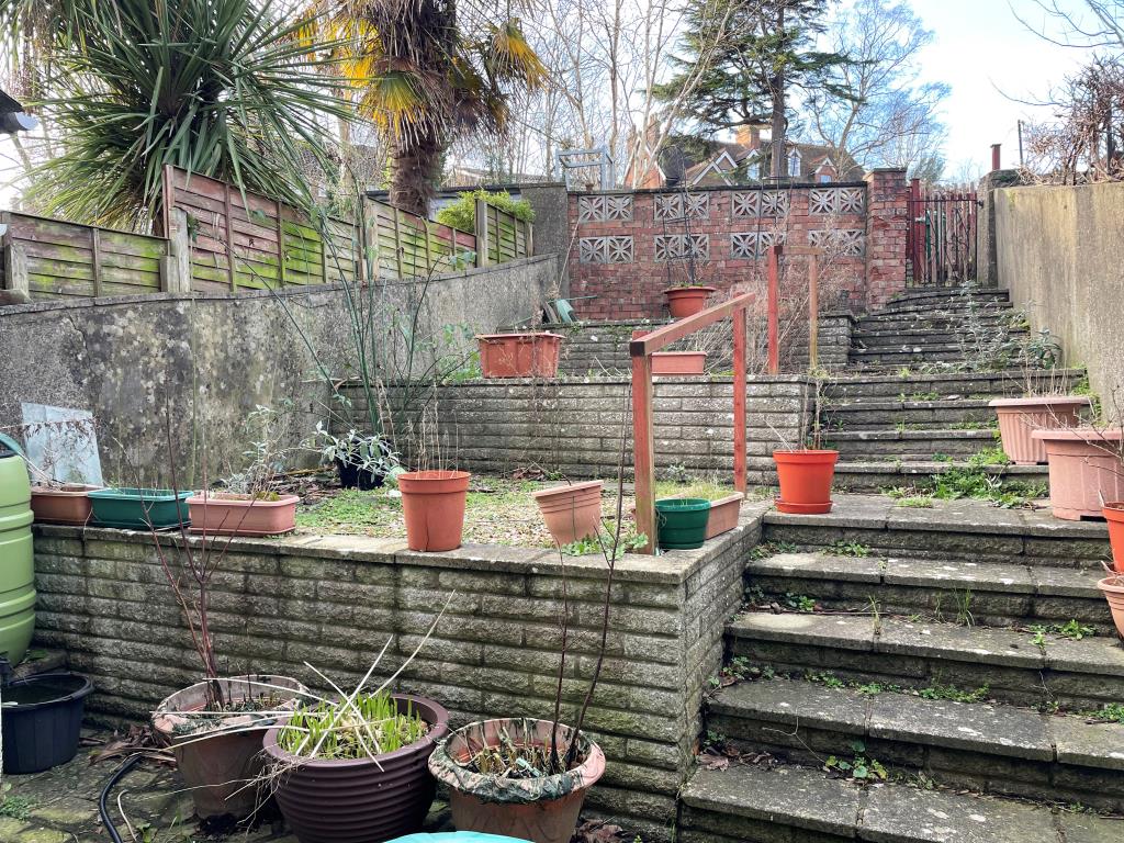 Lot: 88 - TERRACED HOUSE IN NEED OF UPDATING - View of west facing tiered rear garden with rear access